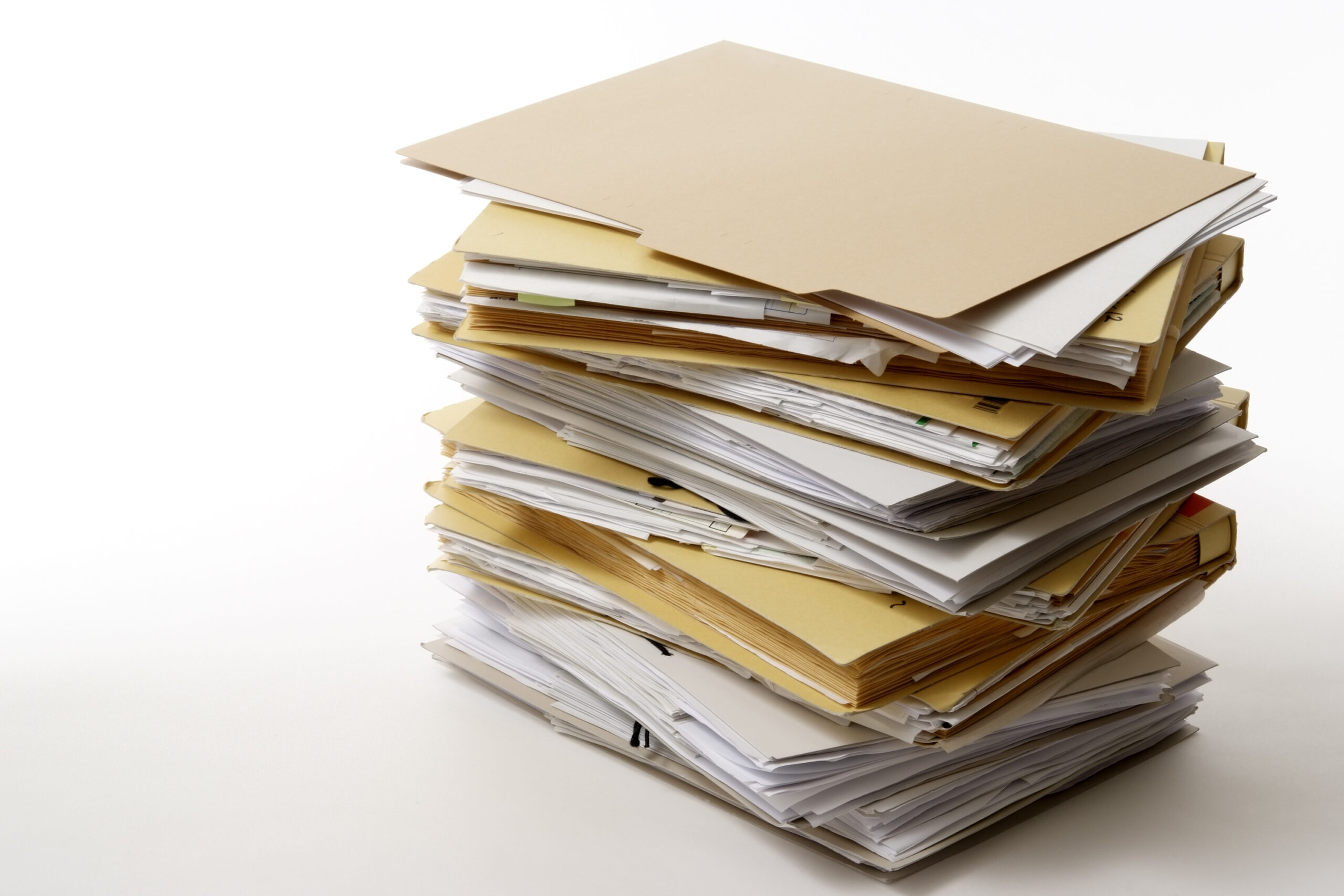 Isolated shot of stacked document folders on white background